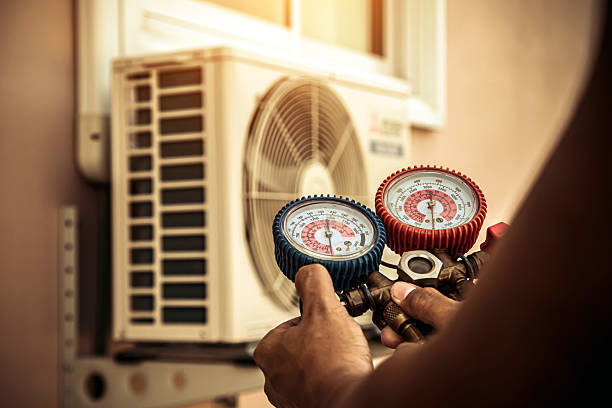 Professional Air Conditioning Service technician working in Puyallup, WA
